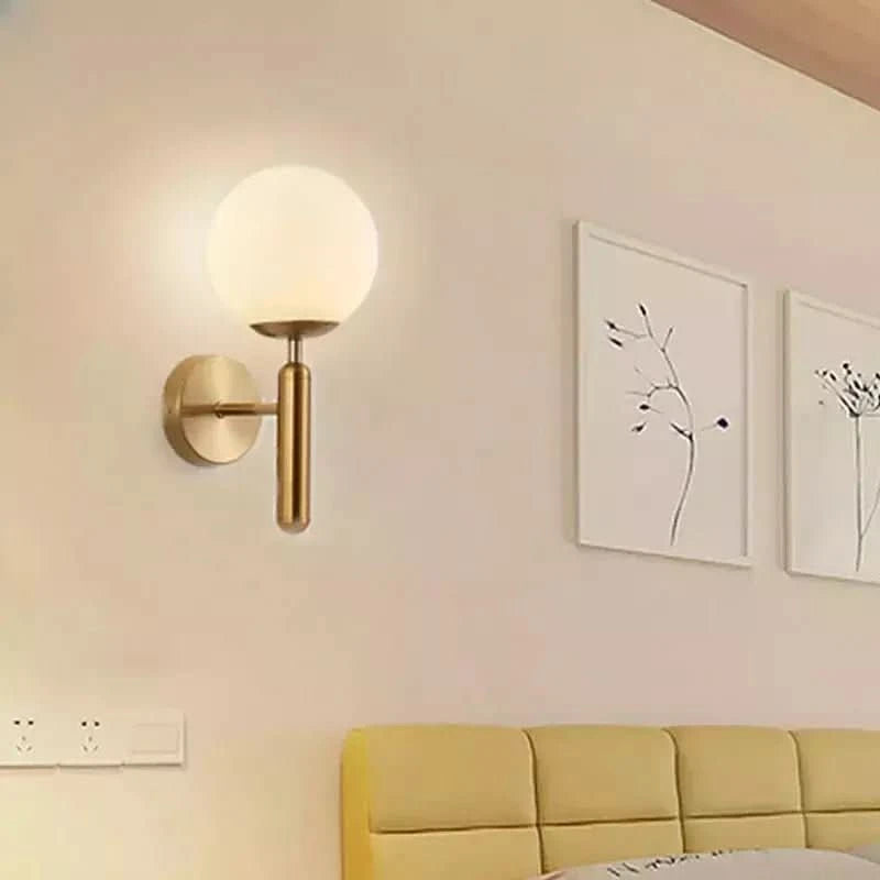 Glass globe wall lamp, gold and black design | Halo