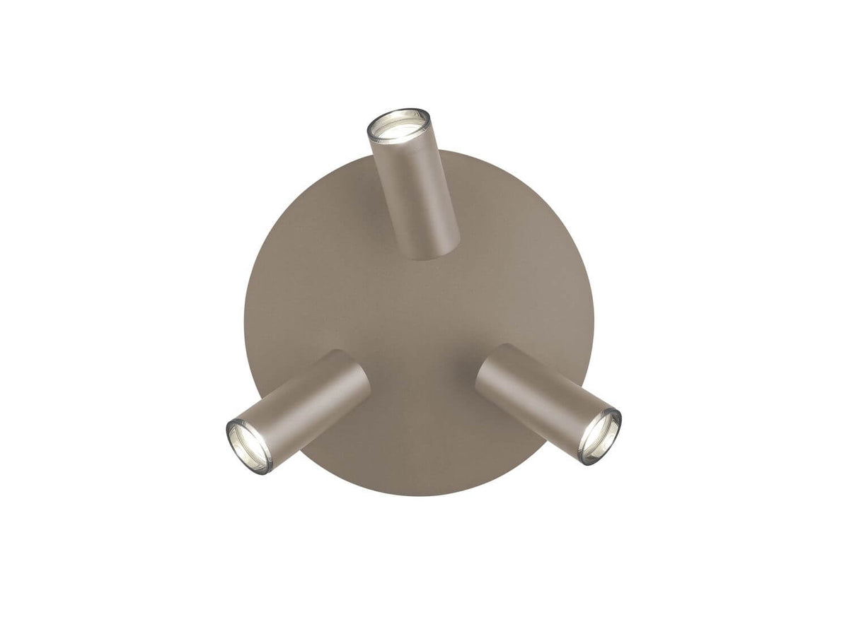 Vue de dessous montrant le disque rond taupe et les trois cylindres orientables