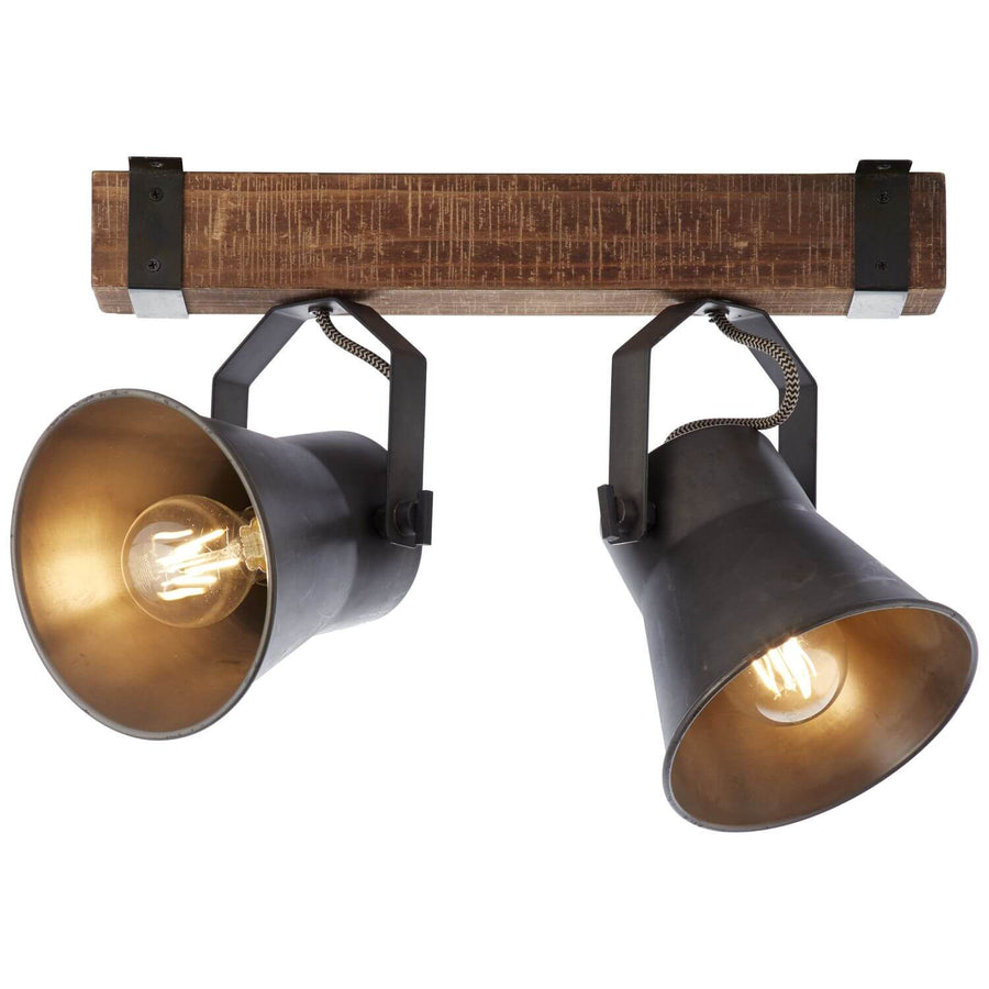 Luminaire allumé vu de dessous, deux cônes orientables sur traverse bois