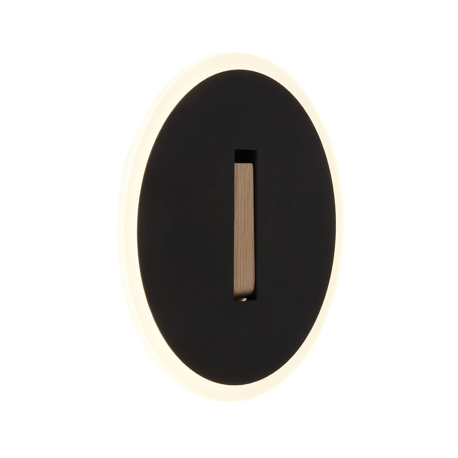 Vue de face de l'applique murale ovale noire avec halo lumineux et insert vertical en bois.