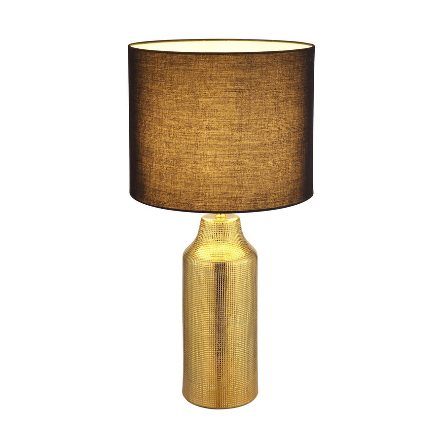 Lampe à poser dorée avec abat-jour sombre et base cylindrique texturée, vue de face.