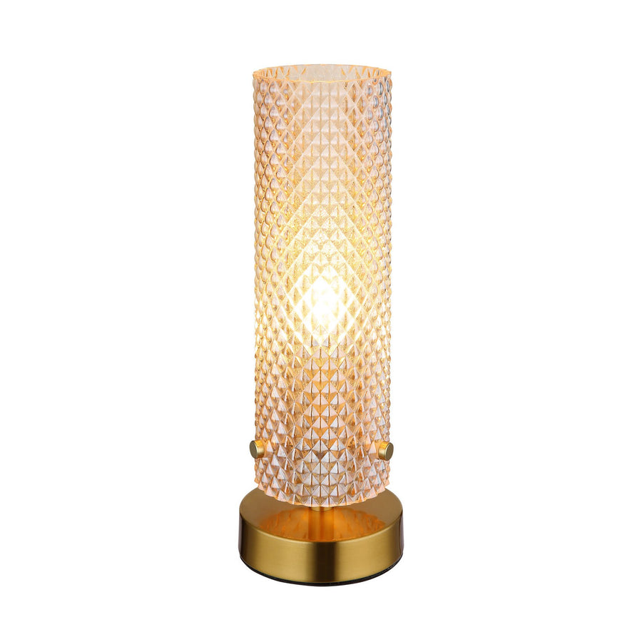 Lampe à poser dorée allumée, vue de face sur fond blanc