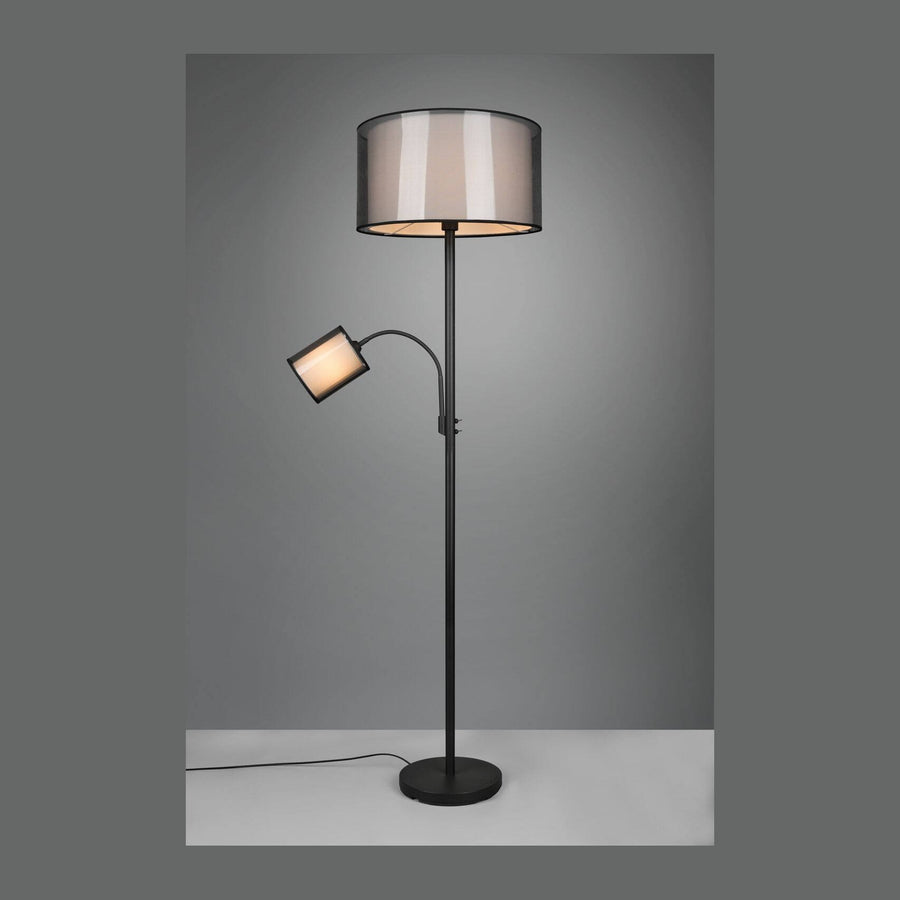 Lampadaire noir mat avec grand abat-jour cylindrique et bras de lecture orientable, vue de face