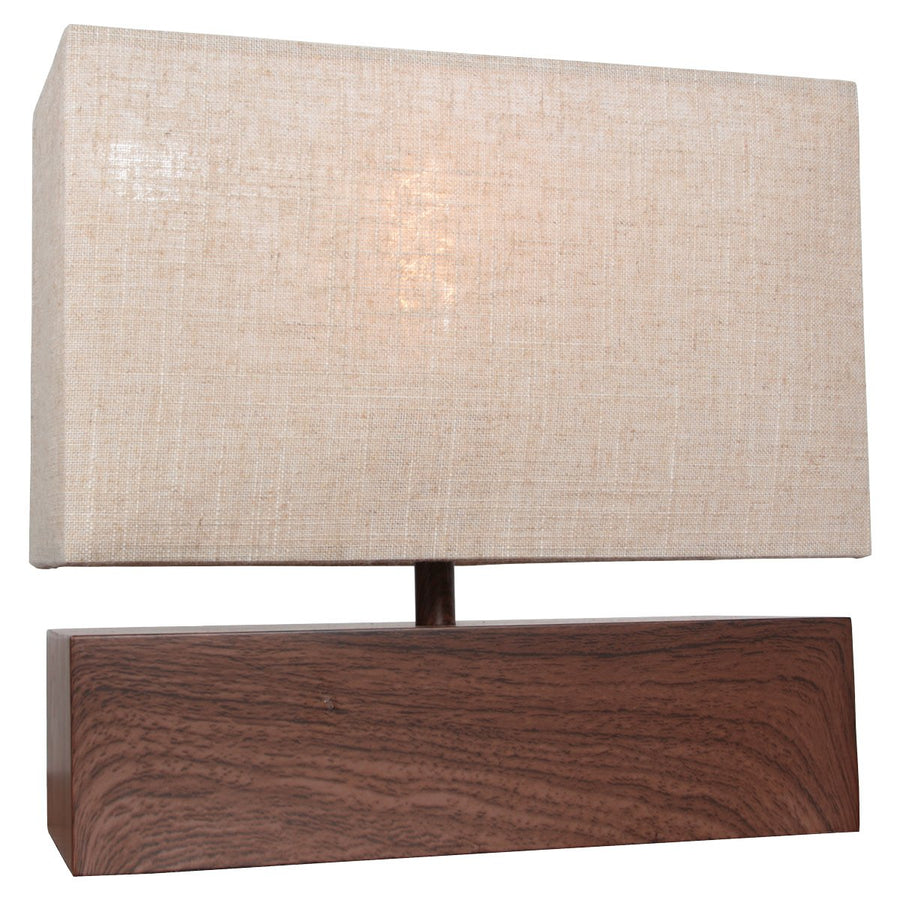 Lampe allumée, la lumière chaude filtre à travers le tissu beige