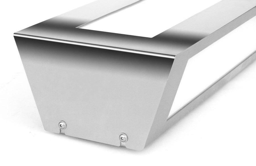 Détail de profil du boîtier en inox avec vis apparentes et ouverture lumineuse latérale.