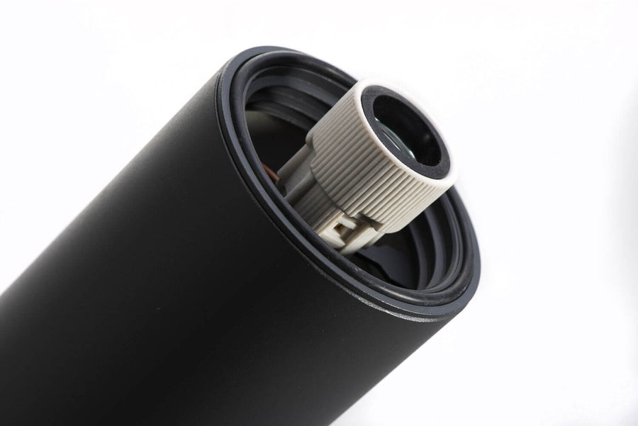 Détail de la douille et du joint d'étanchéité à l'intérieur du support cylindrique.
