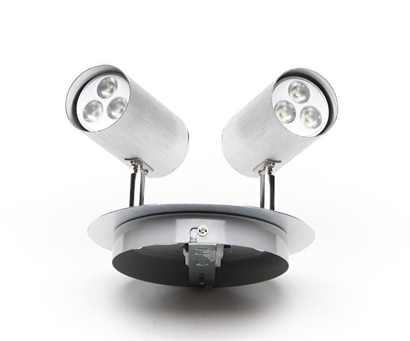 Vue arrière du luminaire avec platine de fixation et deux têtes orientables en aluminium.