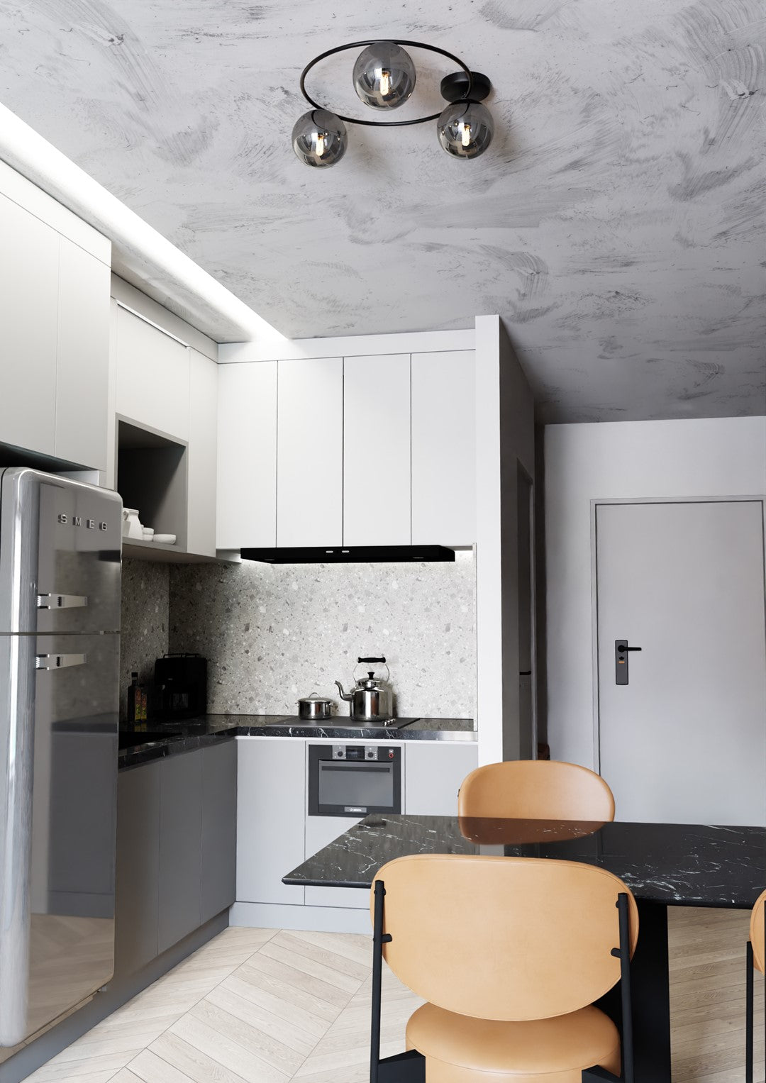 Vue large d'une cuisine-salle à manger avec le luminaire au-dessus de la table.
