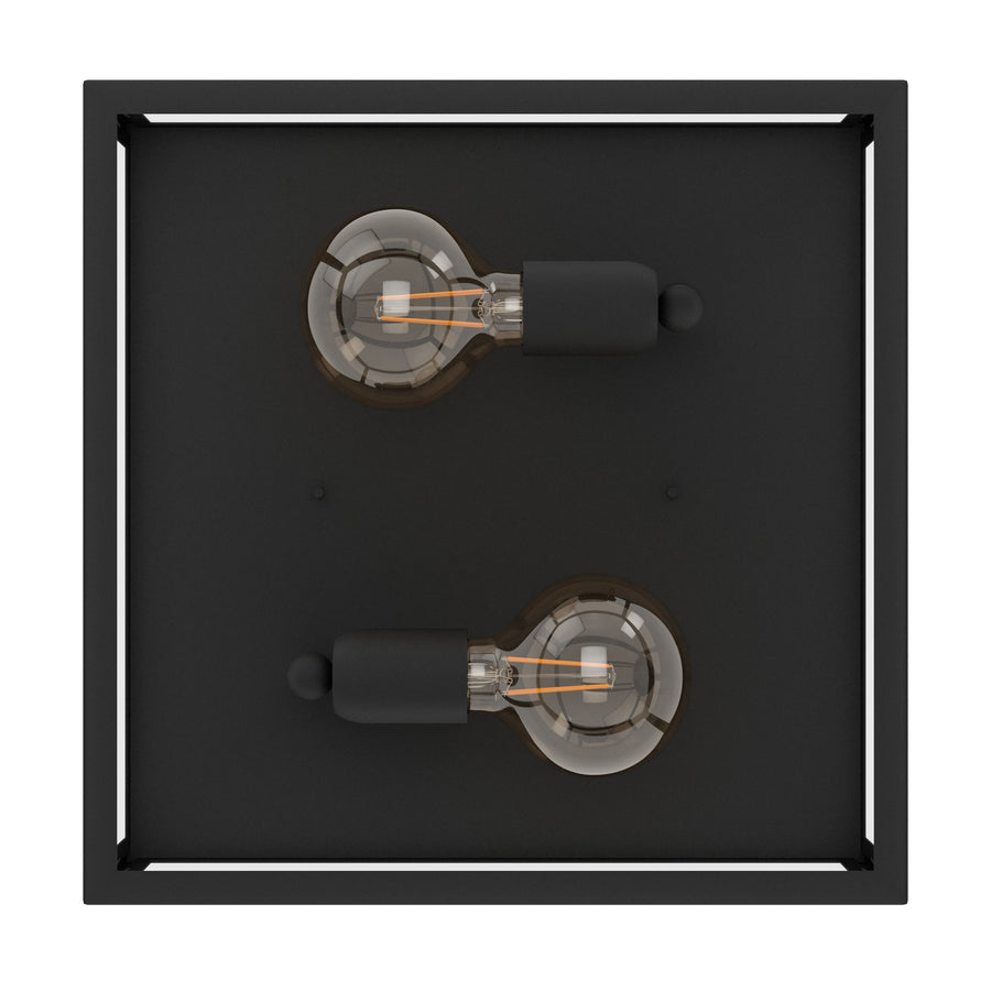 Vue plongeante sur la platine noire, les douilles et les ampoules apparentes