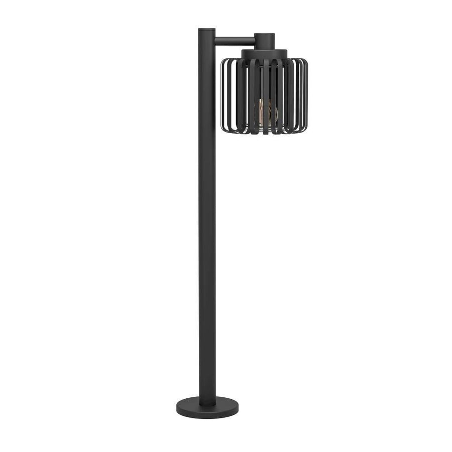 Lampadaire noir sur fond blanc, vue de face avec abat-jour cage cylindrique ajouré