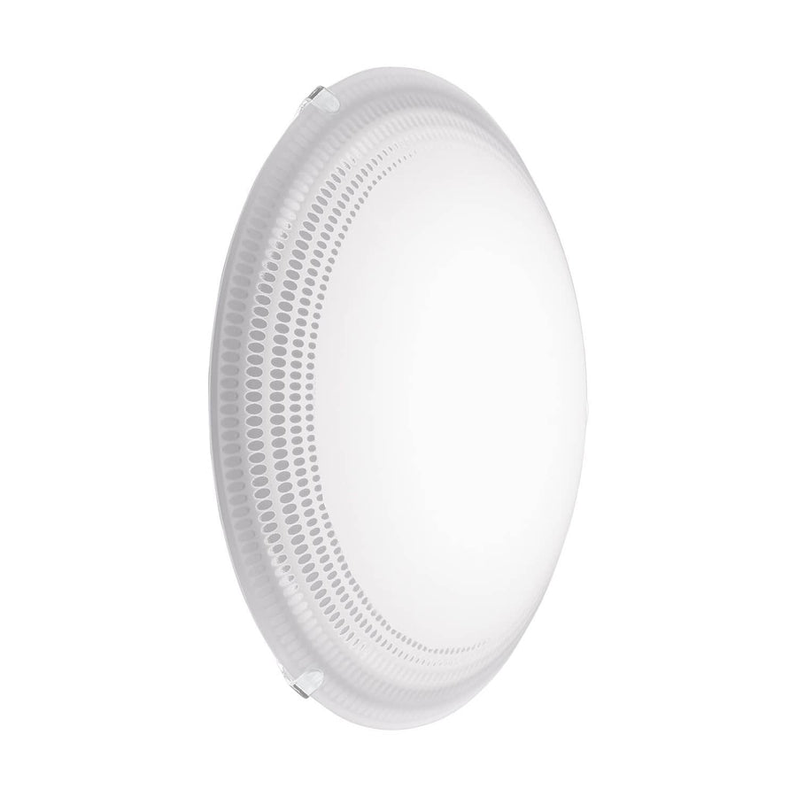 Vue de profil du diffuseur rond en verre translucide, bord perforé de motifs ovales