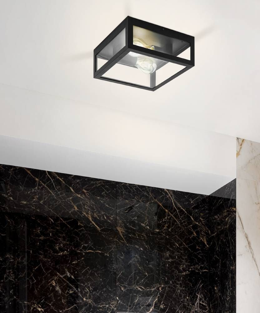 Mise en ambiance du luminaire fixé au plafond blanc devant un mur de marbre noir