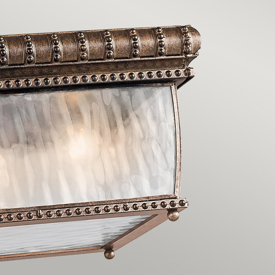 Détail du bandeau supérieur en bronze vieilli, alignements de billes décoratives et verre givré