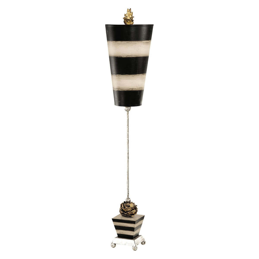 Lampe à poser entière sur fond blanc, abat-jour conique rayé noir et taupe.