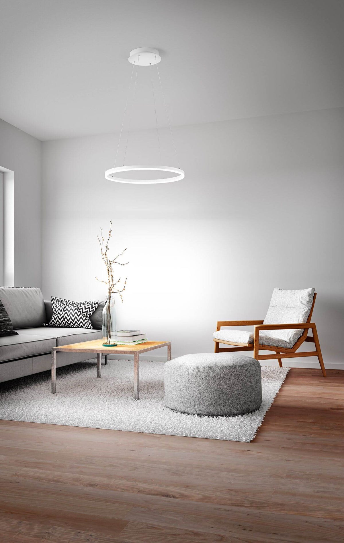 Mise en ambiance salon clair, anneau lumineux blanc suspendu au plafond