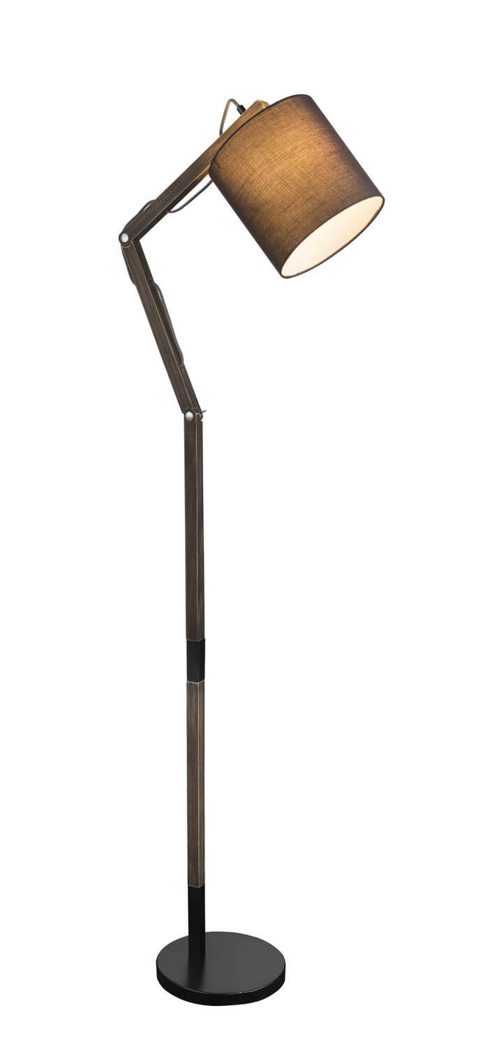 Vue rapprochée du lampadaire montrant l'abat-jour en tissu et les articulations métalliques