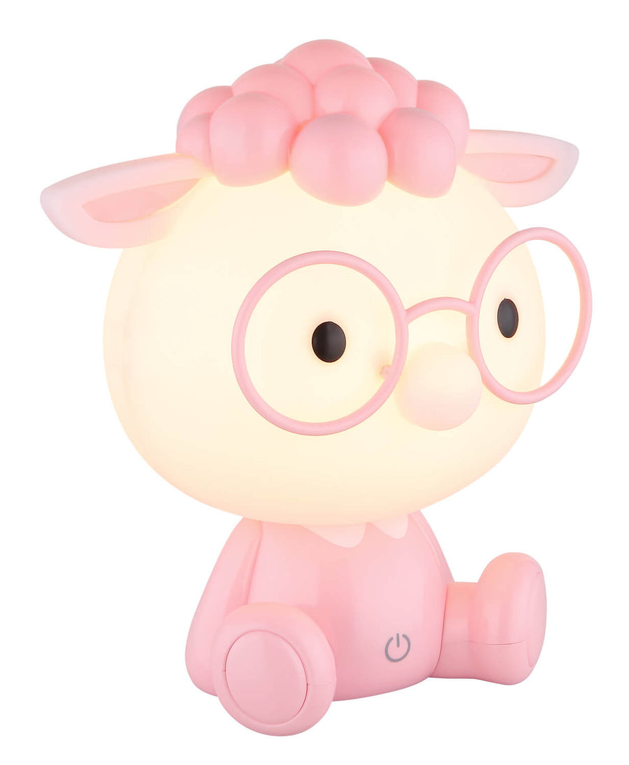 Lampe enfant en forme de mouton rose, tête lumineuse allumée, vue de face trois quarts