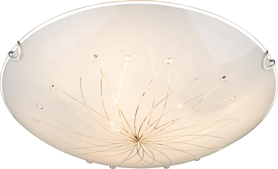 Détail du décor intérieur en fils métalliques et billes formant une étoile, sous verre blanc.