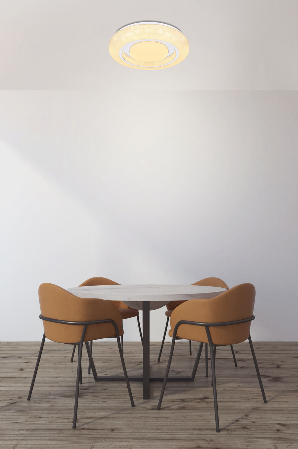 Mise en ambiance du plafonnier au-dessus d'une table ronde en pièce claire