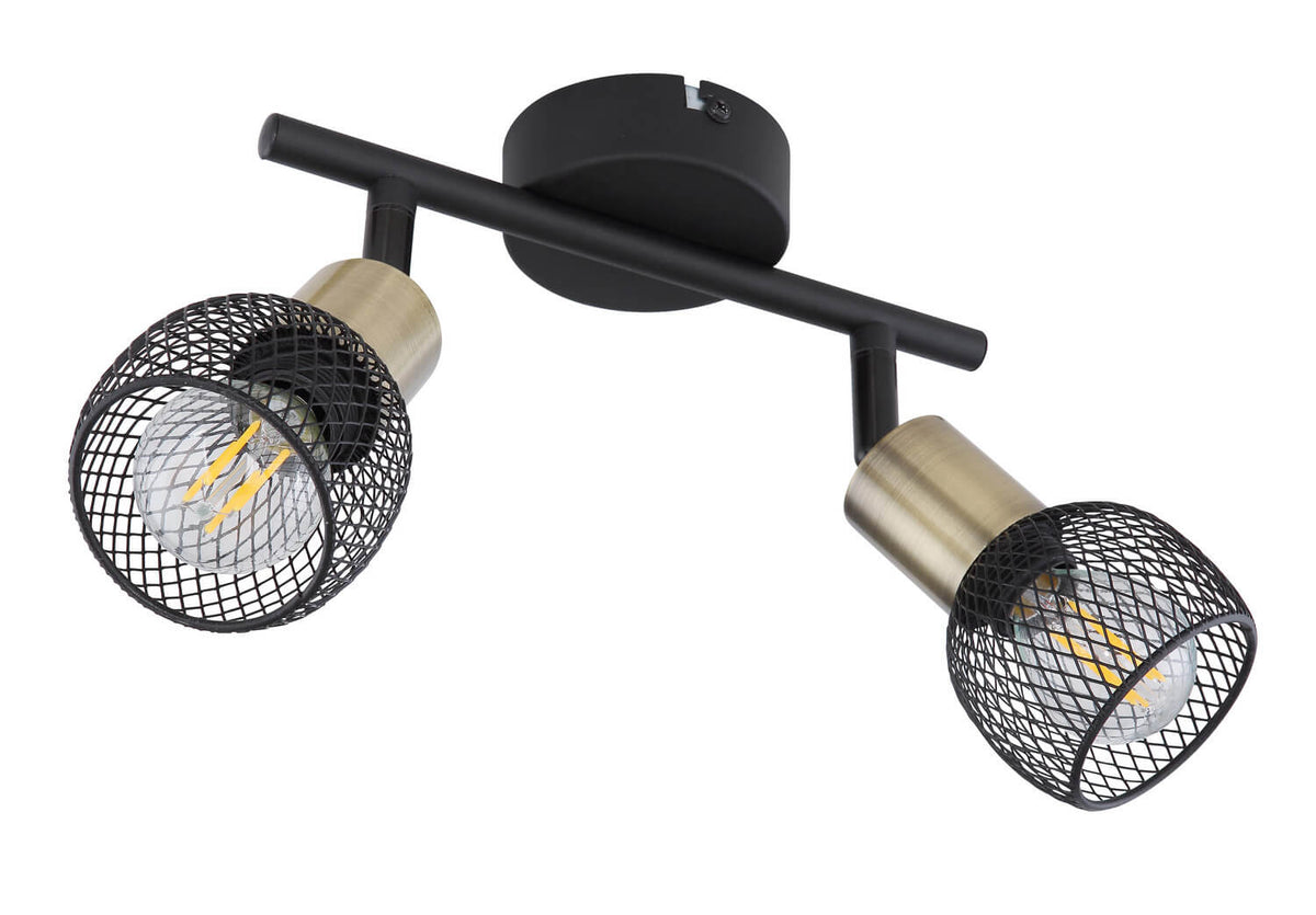 Détail du spot orientable montrant la finition noire mate et le cylindre en laiton brossé