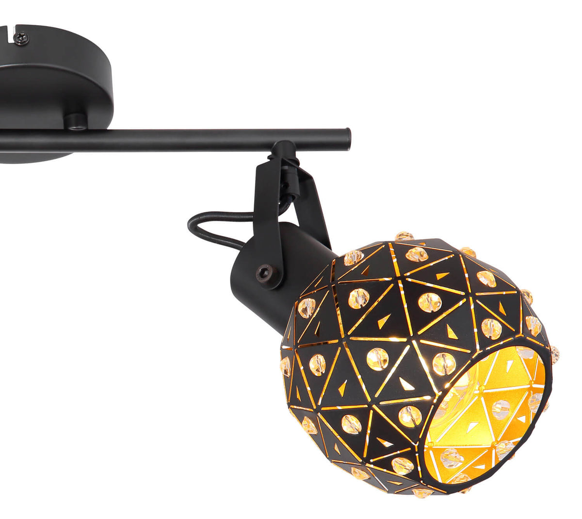 Détail d'une tête lumineuse avec cerclage noir, triangles dorés et perles de cristal.