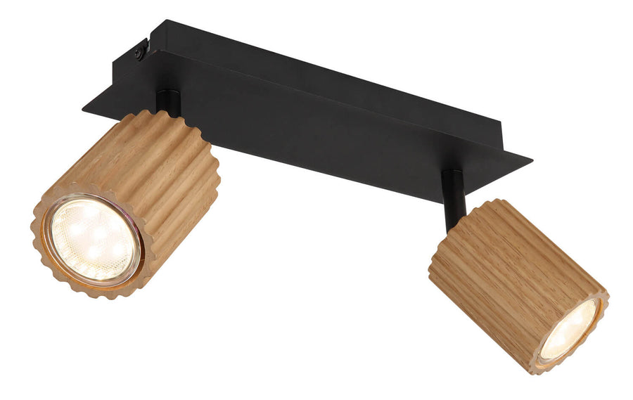 Gros plan sur la tête cylindrique en bois cannelé et son ampoule LED allumée