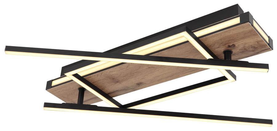 Vue en contre-plongée du plafonnier montrant ses cadres superposés et sa lumière chaude.
