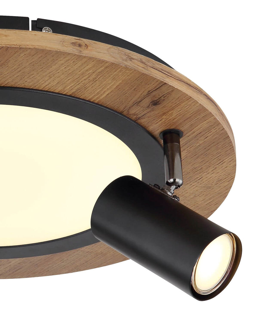 Détail de la finition bois et de l'articulation d'un spot noir orientable