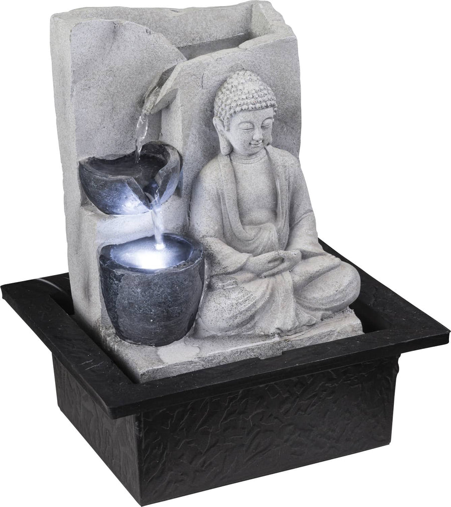 Fontaine décorative Bouddha en pierre grise avec eau lumineuse ruisselante.