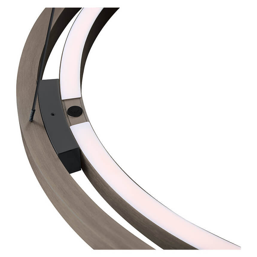 Détail de la finition bronze brossé et du module de fixation avec bandeau LED allumé.