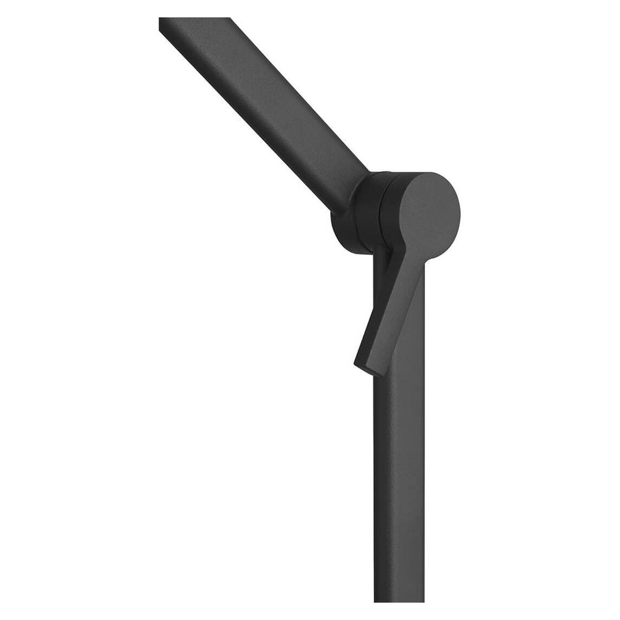 Détail du bras articulé et de la rotule de réglage en métal noir mat.