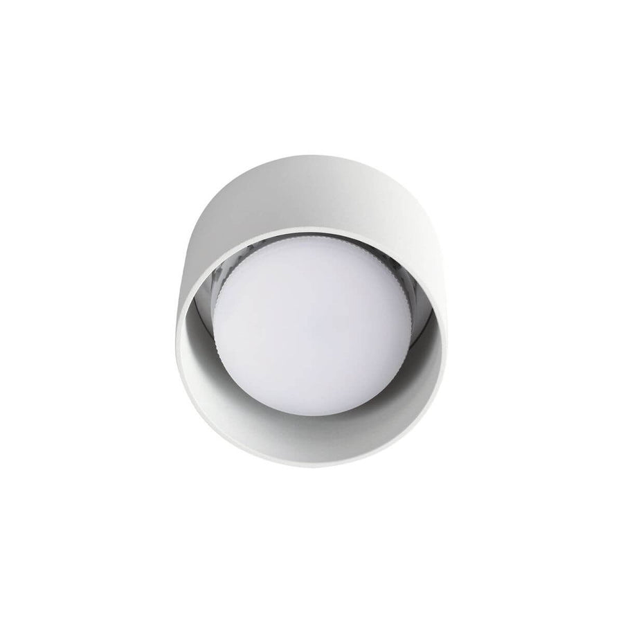 Vue de dessous dévoilant le diffuseur opale bombé et l'intérieur blanc