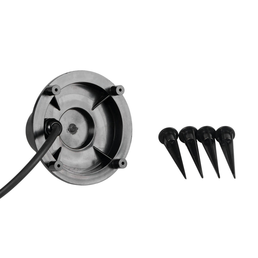 Dessous du support noir avec picots et quatre piquets de fixation au sol.