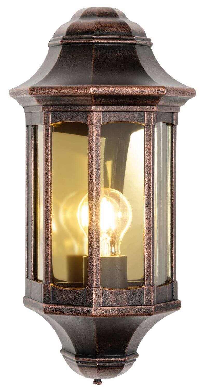 Lanterne murale allumée avec ampoule à filament, lumière chaude sur verre transparent.