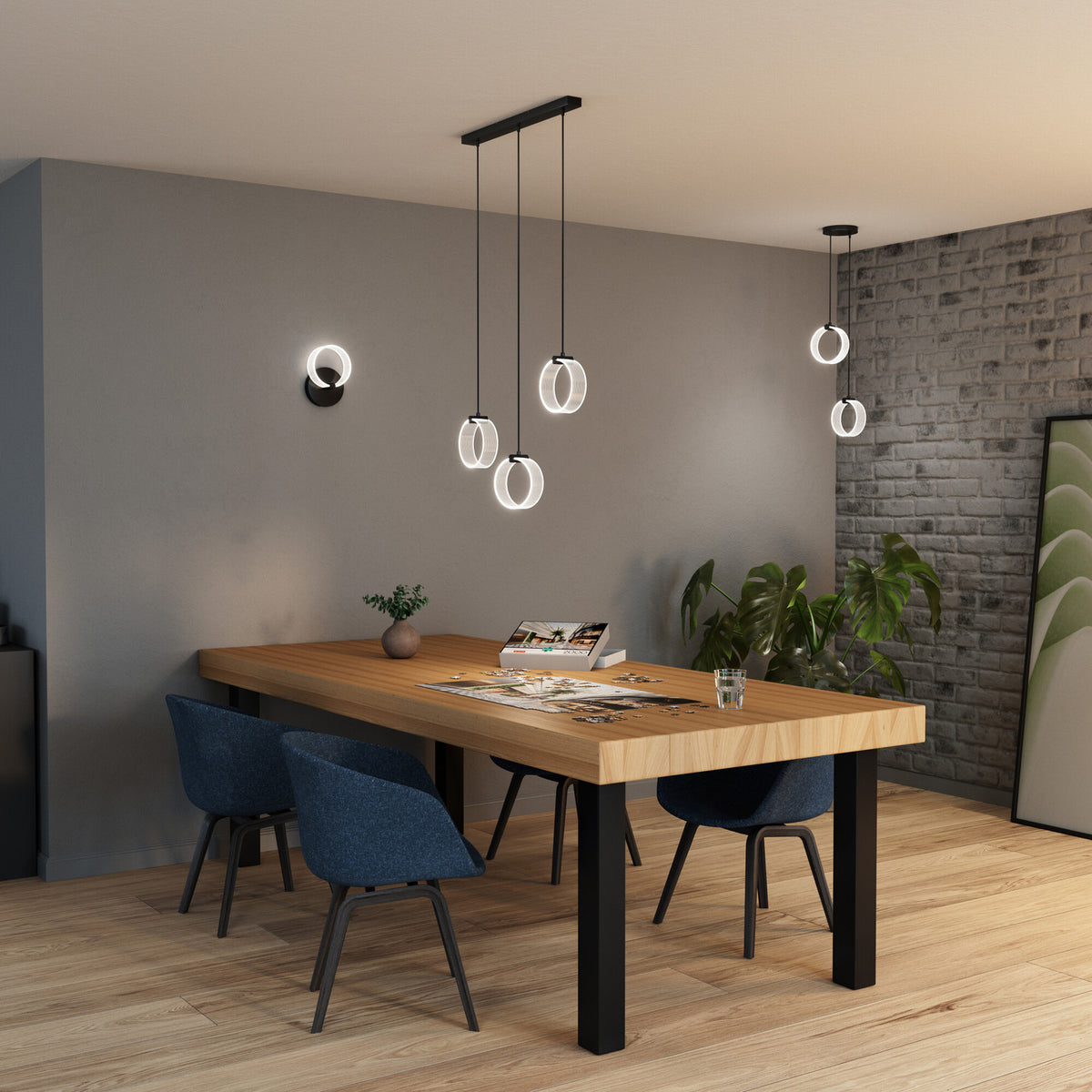 Vue d'ensemble d'une salle à manger contemporaine avec suspension à anneaux LED lumineux.