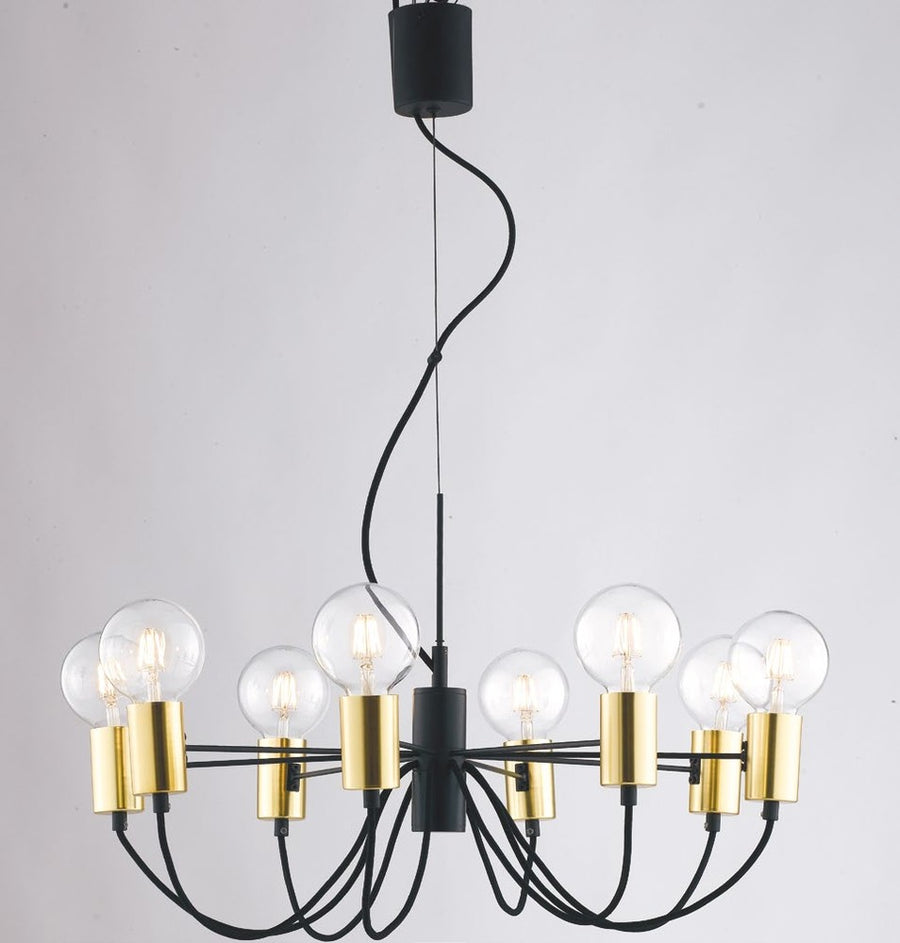 Vue de trois-quarts du luminaire, câbles noirs courbés et douilles dorées avec globes transparents.