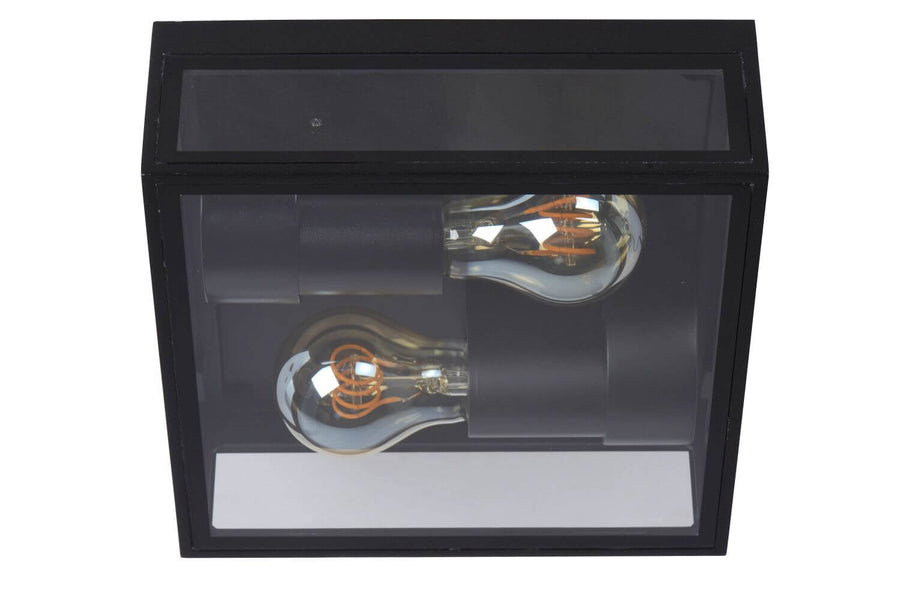 Second angle du luminaire sur fond blanc, mettant en valeur le verre et les douilles noires.