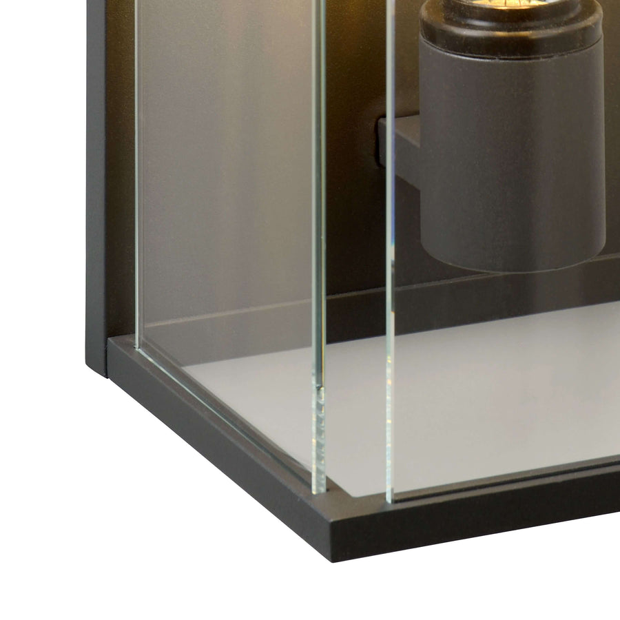Détail de la base, panneaux de verre insérés dans le cadre métallique anthracite