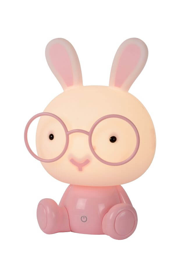 Vue de face de la lampe lapin rose allumée sur fond blanc