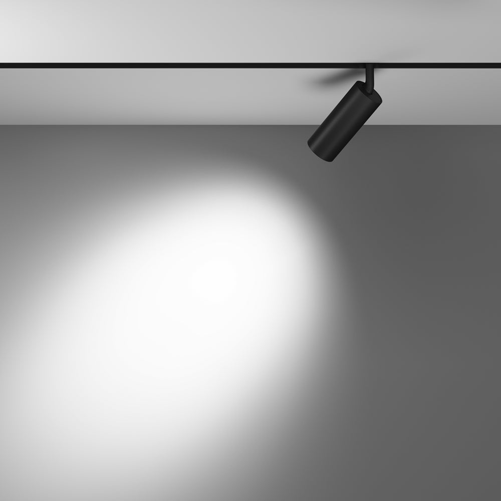 Mise en ambiance : large halo de lumière projeté sur un mur