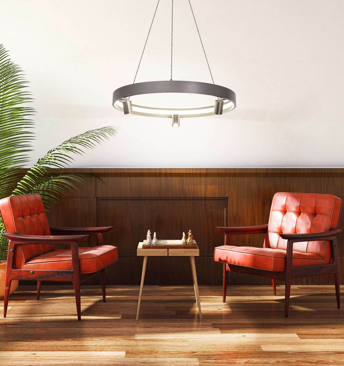 Mise en ambiance salon bois, suspension anneau allumée au-dessus d'une table et fauteuils cuir.