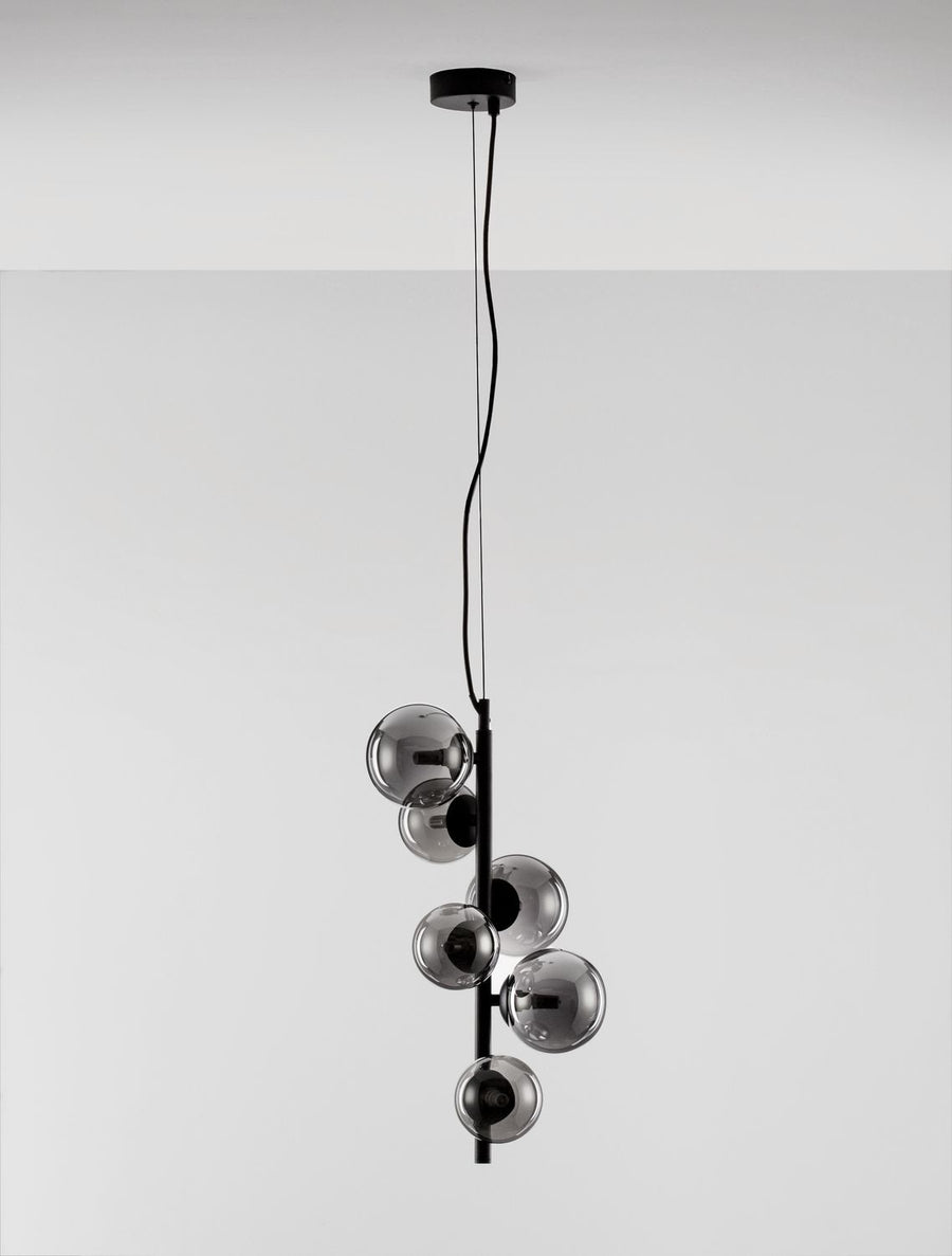 Produit entier sur fond blanc, câble noir et globes transparents alignés verticalement.