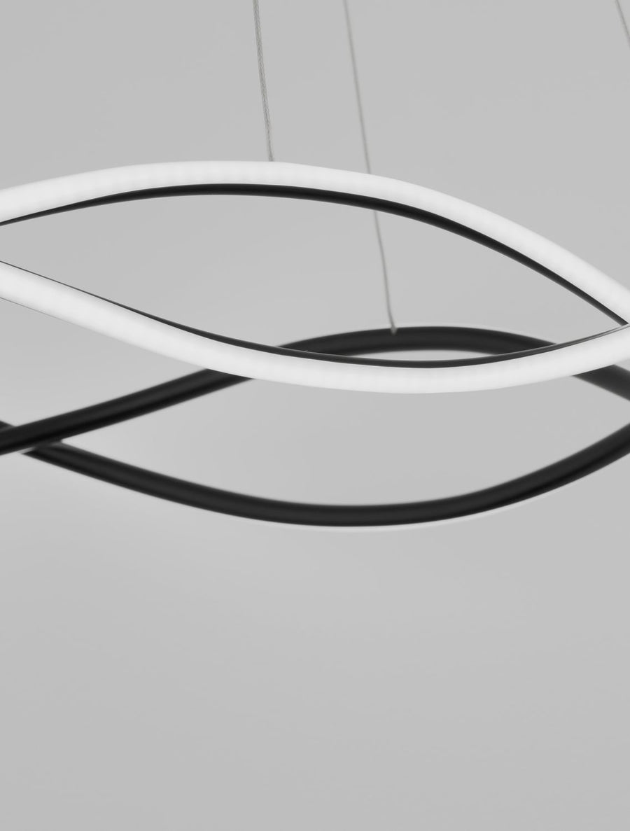 Détail de la finition noire mate et du tube lumineux blanc diffusant.