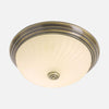 Round bronze ceiling light, cream ribbed glass for living room | Lumea