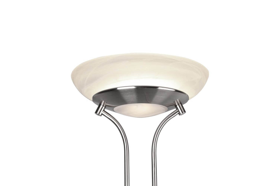 Gros plan du diffuseur supérieur en verre blanc et collier métallique satiné.