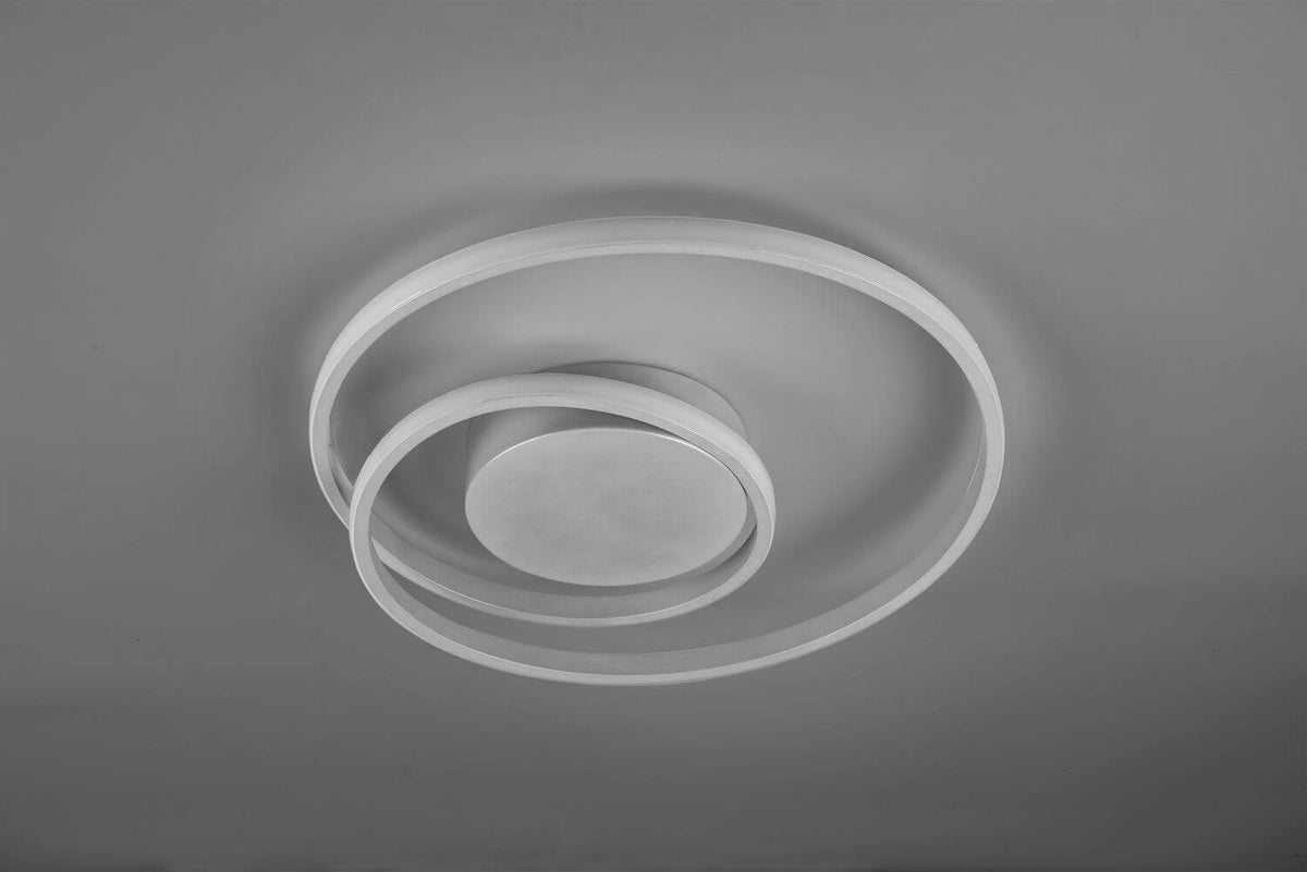 Vue de dessous éteinte montrant la structure blanche mate des deux anneaux et disque