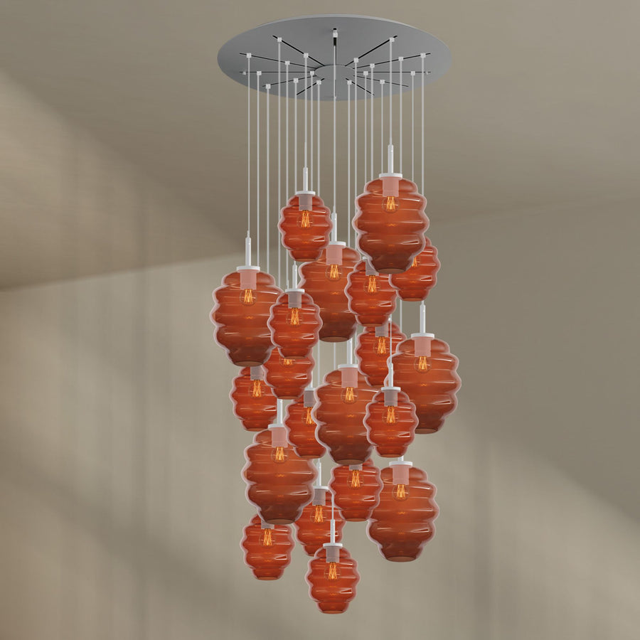 Version à câbles et rosace blancs avec verres orange ambré translucides.