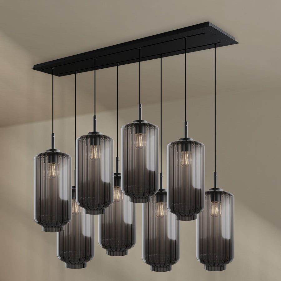 Version verre fumé noir, huit cylindres cannelés suspendus sous un plateau noir