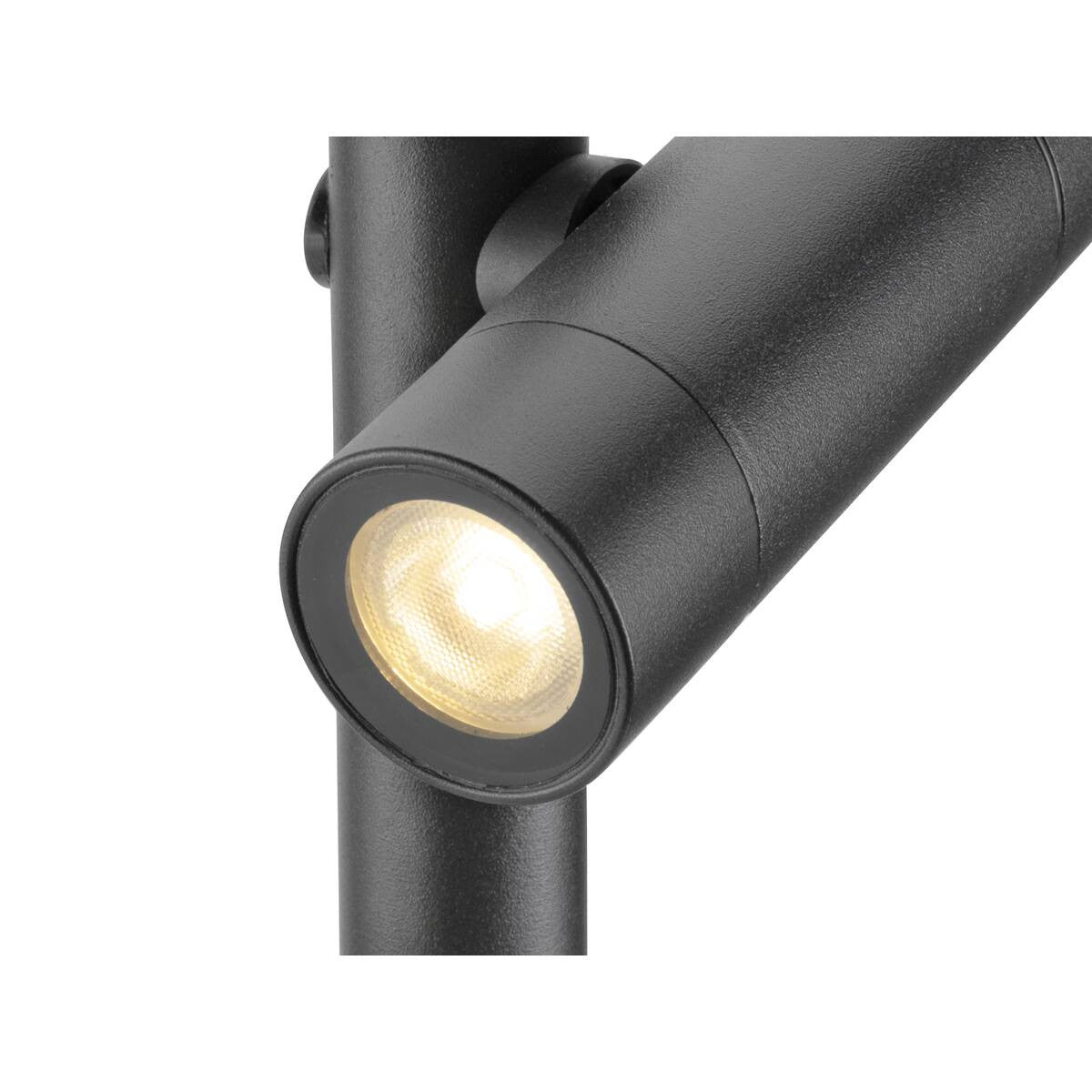 Détail rapproché du spot cylindrique noir et de la lentille LED allumée.