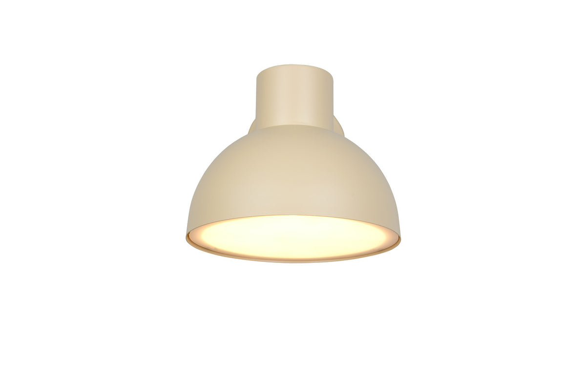 Vue de dessous de l'applique allumée, abat-jour bombé et col cylindrique beige.